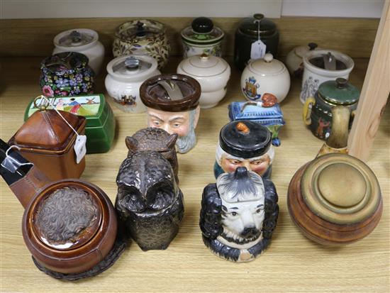 A French novelty tobacco jar in the form of a pipe and twenty novelty and other tobacco jars